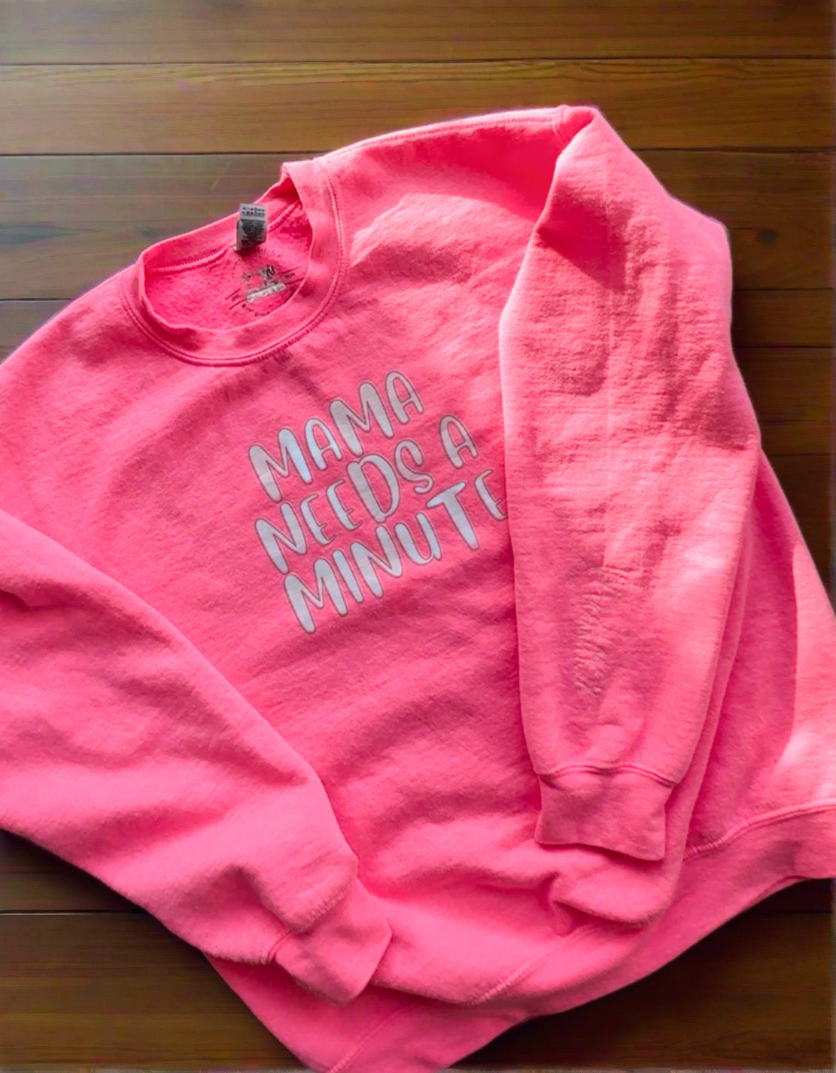 pink sweatshirt with "Mama needs a minute" on it 